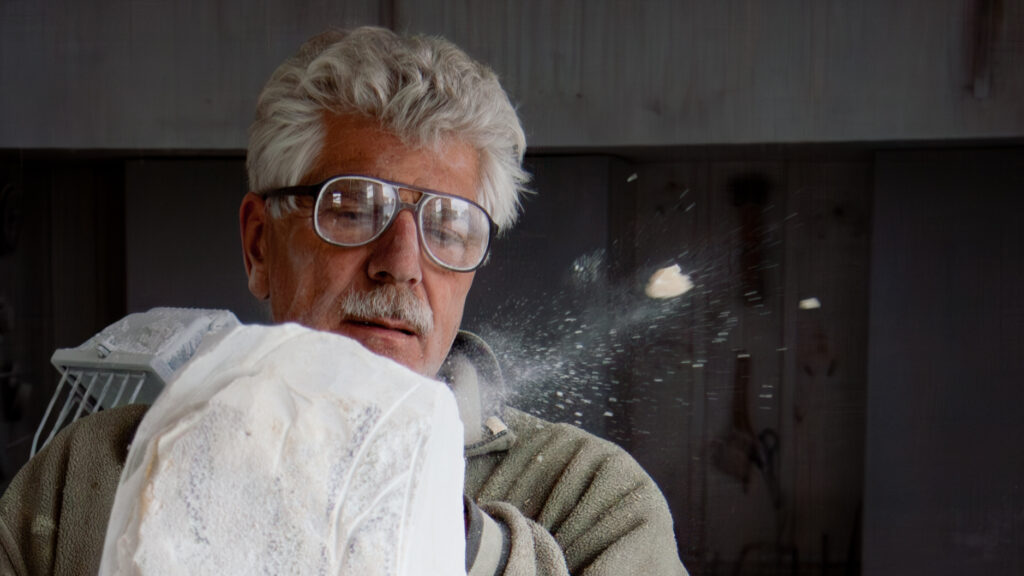 Maarten sculpting a marble block