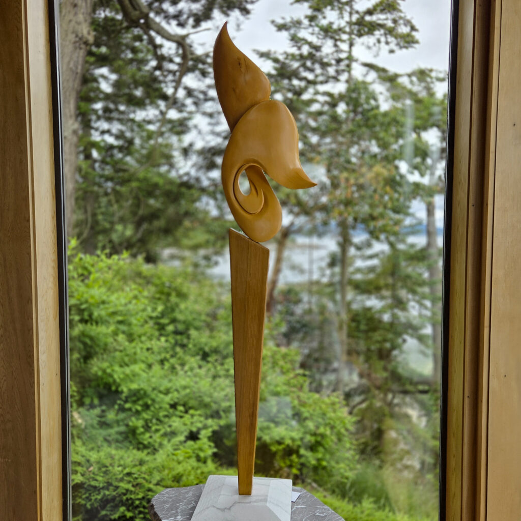 Yellow Cedar Whale Tail on Red Cedar and Marble Pedestal Wood Sculpture. View the Video Walk In The Amazing Gallery Entrance