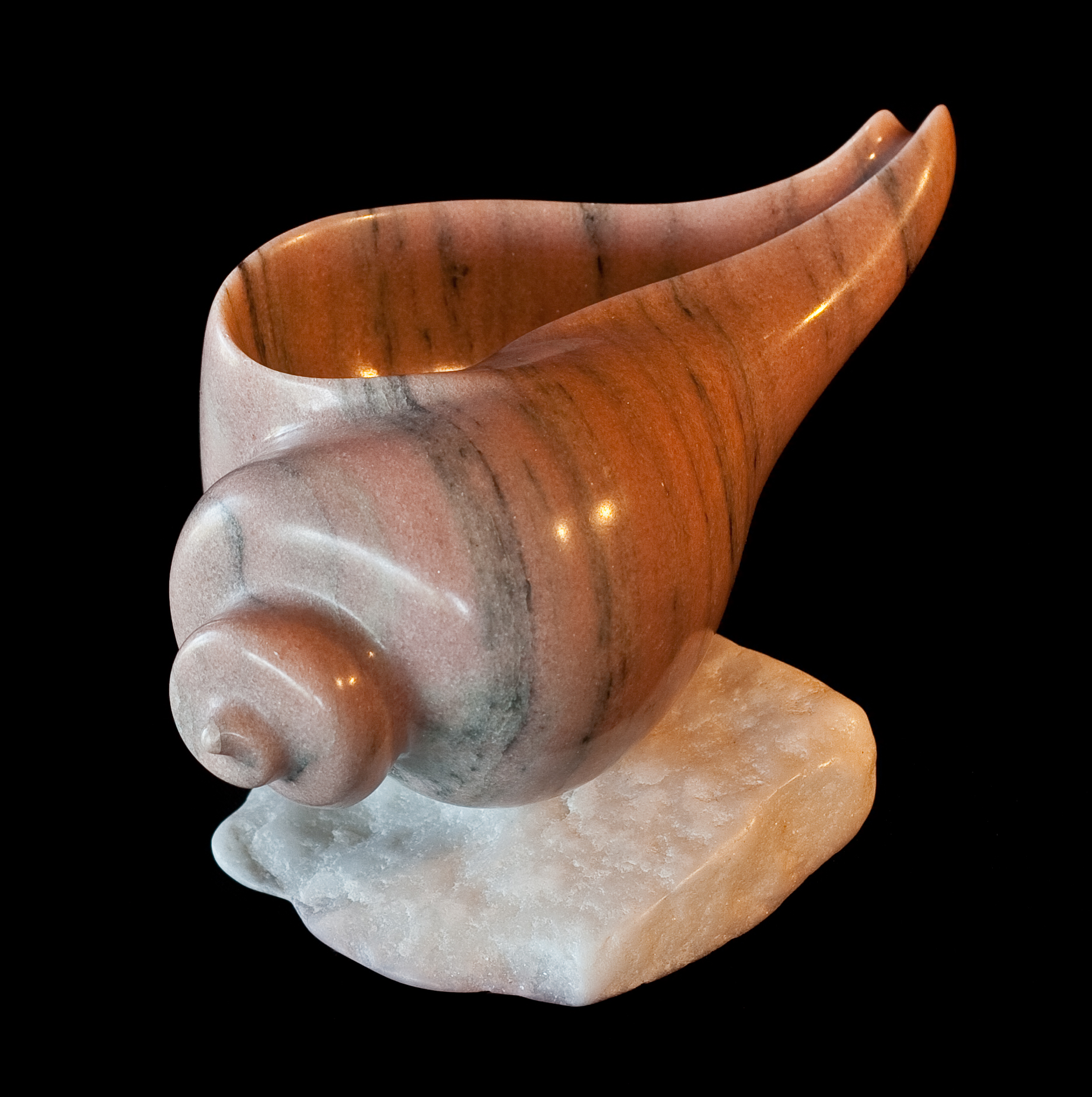 Pink Marble stone sculpture of a shell on a stone base. Approximately 18 cm tall.